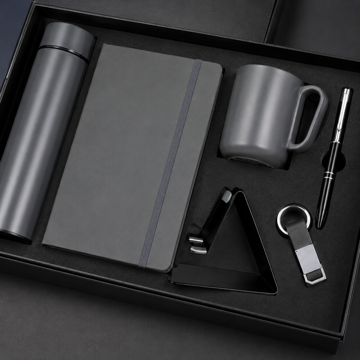 6 IN 1 BLACK A5 NOTEBOOK, TEMPERATURE BOTTLE, STEEL MUG, MOBILE STAND, PEN, & KEYCHAIN image 2